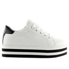 Weiße Turnschuhe auf hoher Sohle