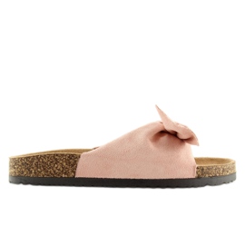 Rosa Pantoffeln auf der Korksohle