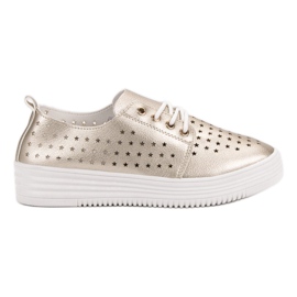 Goldene durchbrochene Sneakers