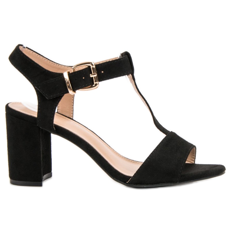 Anesia Paris Schwarze Sandalen auf einer Bar