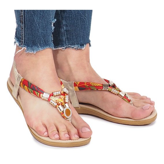 Goldene flache Sandalen mit Sprottendiamanten