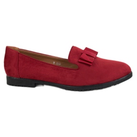 Miss Laura Lords mit einem Bogen rot