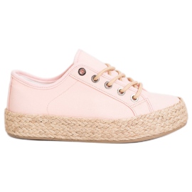 Kylie Turnschuhe auf einer Strohplattform rosa