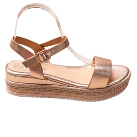 Weide Goldene Sandalen mit verziertem Plateau