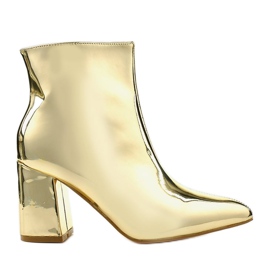 Goldene Stiefeletten am Pfosten, der SY50P Gold-Reißverschluss