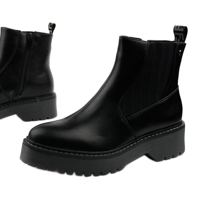 Schwarze flache Stiefel aus Cavern-Ökoleder