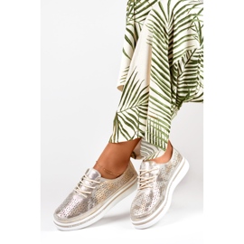 Goldene Damen-Sportschuhe aus echtem Leder 1