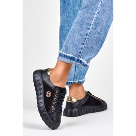 Sportschuhe aus schwarzem Leder mit goldenen Details 1