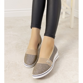 Goldene Turnschuhe mit Keilabsatz von Burris 2