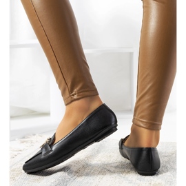 Schwarze Loafer mit goldener Theresa-Schnalle 1