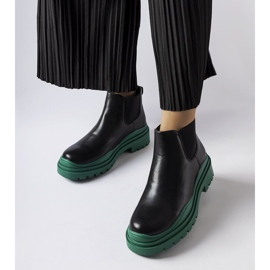 Schwarze Stiefeletten auf einem farbenfrohen Marinone-Plateau 1