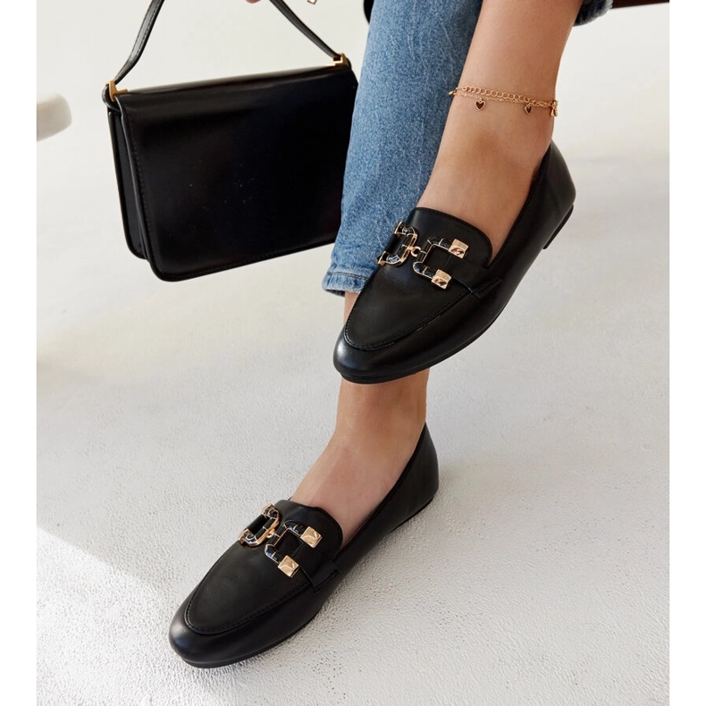 Schwarze Slipper mit Comerio-Schnalle 1