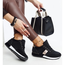 Schwarze Turnschuhe auf einer Nihad-Gummiplattform 1