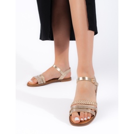 Goldene flache Damensandalen 1