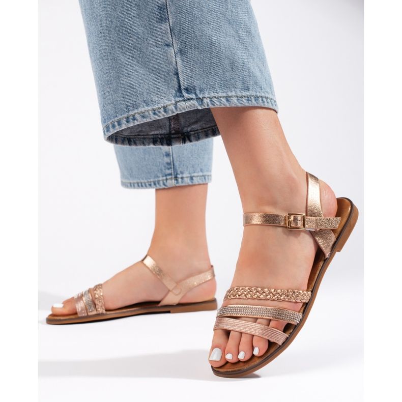 Goldene flache Damensandalen 1