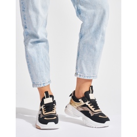 Schwarz-goldene Sneakers mit dicker Sohle 1