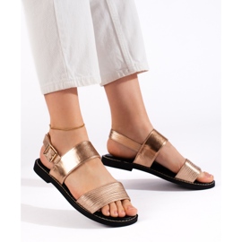 Goldene flache Damensandalen 1