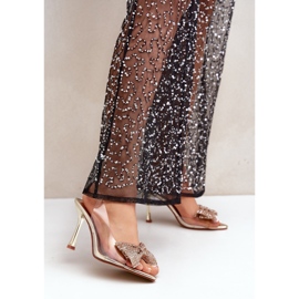 Transparente Sandaletten mit hohen Absätzen und goldglänzender Schleife golden 2