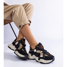 Schwarze Turnschuhe mit goldenen Einsätzen 1