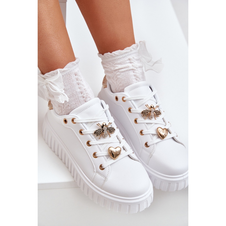 Frauen -Turnschuhe mit weißen Stiften 2