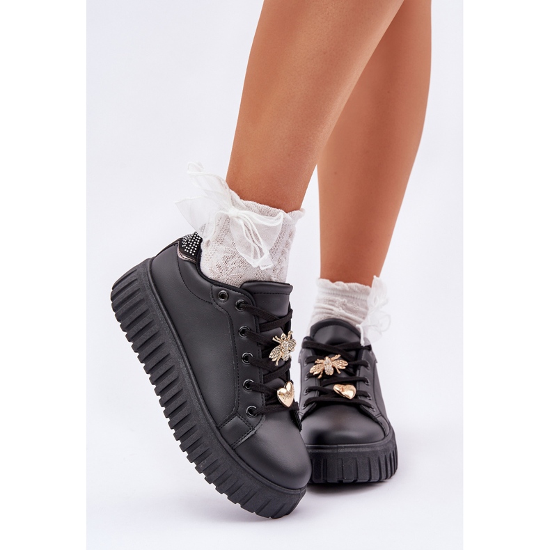 Frauen -Turnschuhe mit schwarzen Stiften 2