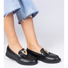 Schwarze Frauenlaafer mit einer eleganten Dekoration 1