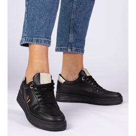 Schwarze Frauen -Turnschuhe mit goldenem Glitzer 1