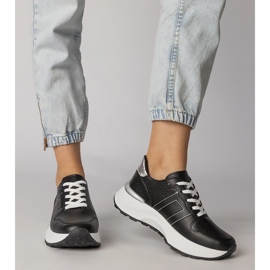 Schwarze Sport -Turnschuhe mit einem silbernen Einsatz 4