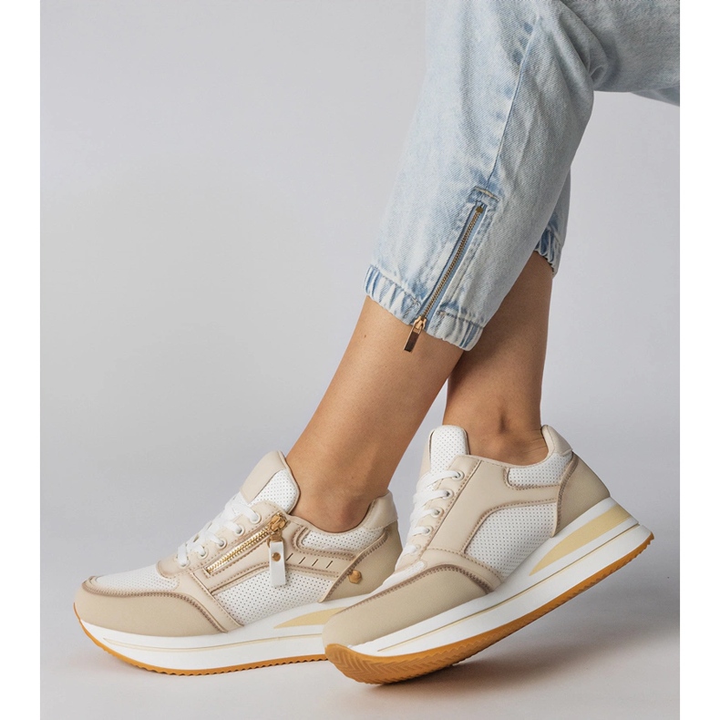 Beige Sportsneaker mit einem Schieberegler dekoriert 2