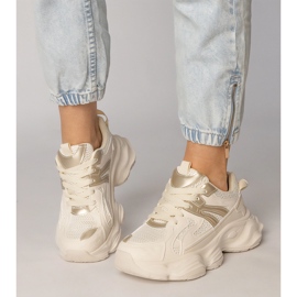 Beige Sneakers Damensport mit einer goldenen Einfügung 2