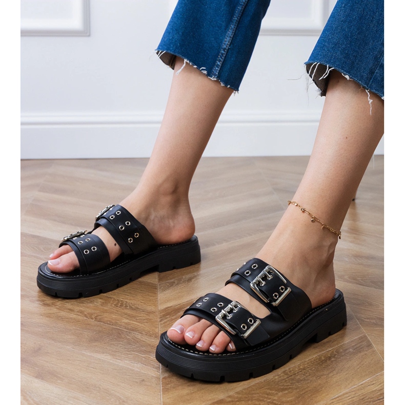 Schwarze Flat -Flip -Flops mit Klemmen auf Streifen 1