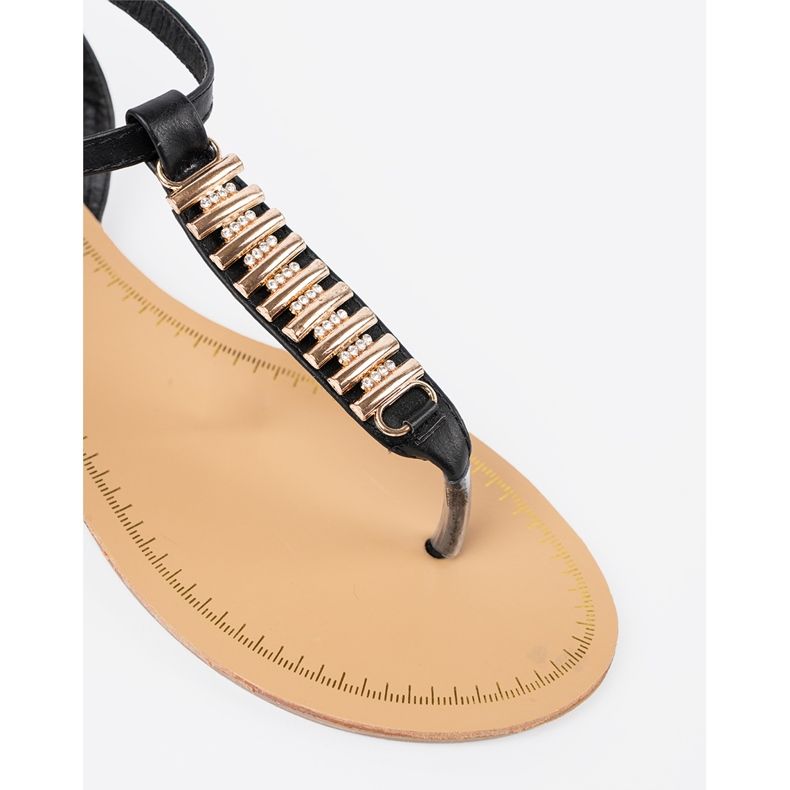 Schwarze Frauensandalen mit goldenen Dekorationen 1