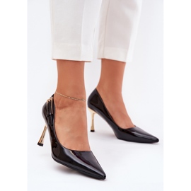 Lackierte High Heels mit einer goldenen Klemme schwarz 2