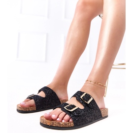 Schwarze Glitzer -Flip -Flops auf der Korkensohle der Flotte 1