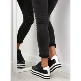 Schwarze schwarze Turnschuhe mit hoher Sohle 1