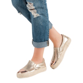 Modische goldene Turnschuhe 2