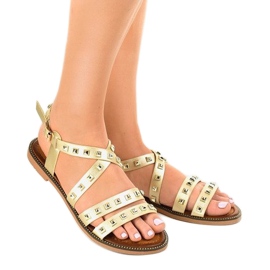 Goldene flache Sandalen verziert mit M-520 1