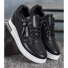 Weide Schwarze Evolutions-Turnschuhe 1