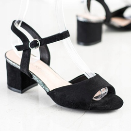 Schwarze Sandalen auf einer Bar Sergio Leone 1