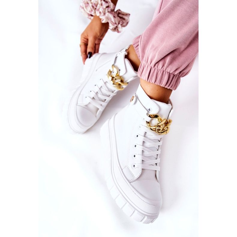 Hohe Sneakers auf der weißen Standies-Plattform golden 1